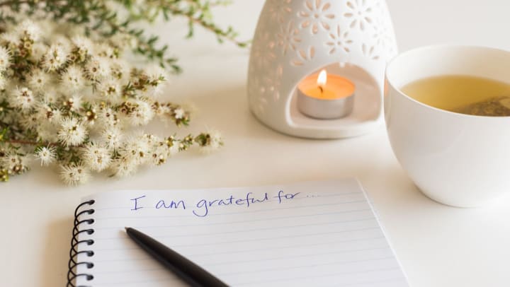 Notebook with "I am grateful for" in handwritten text