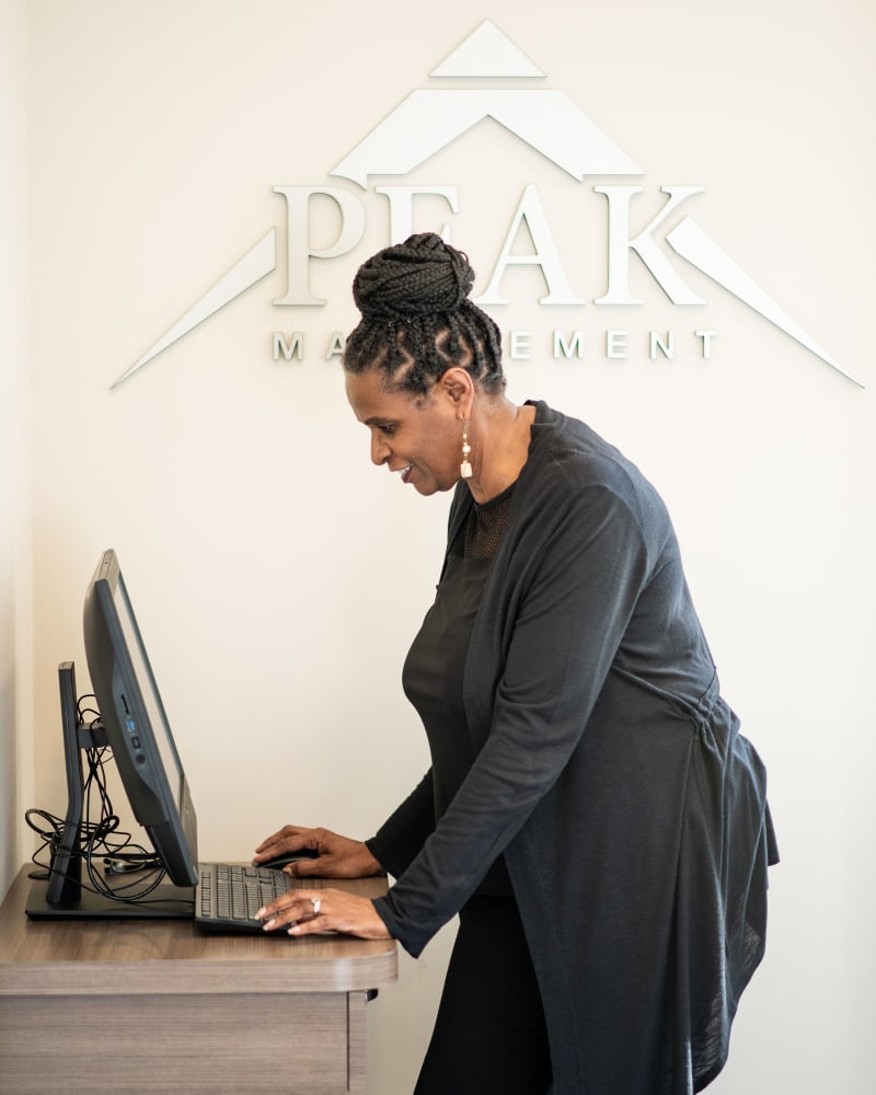 Employee at work at Peak Management