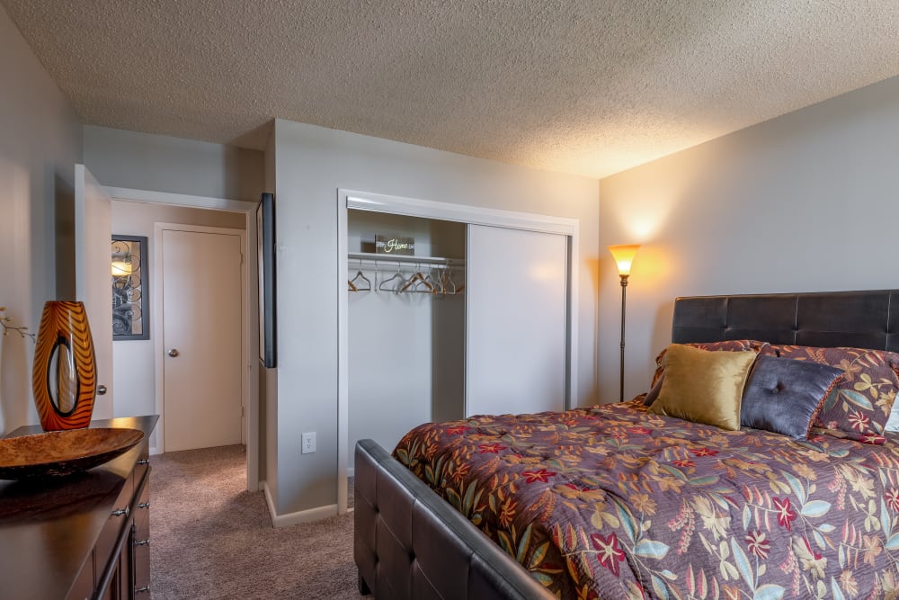 Cozy bedroom at River Park Tower Apartment Homes in Newport News, Virginia