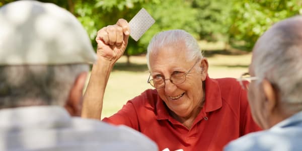 Residents having fun playing cards outside at Retirement Ranch in Clovis, New Mexico