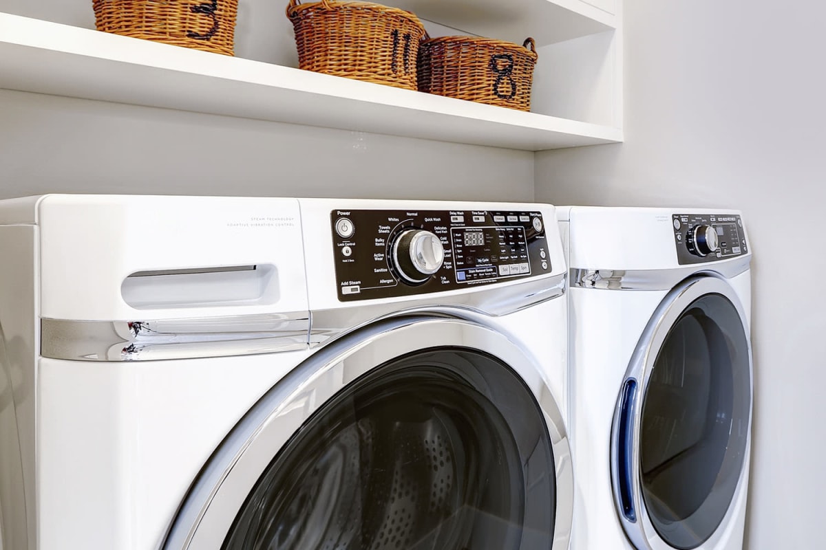 A full-sized washer and dryer in an apartment at Artisan Living North Beach in Santa Rosa Beach, Florida