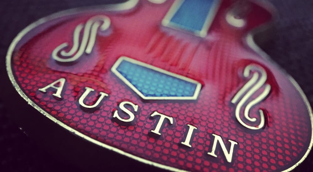 Guitar pin with 'Austin' on it in a gift shop near The Guthrie in Austin, Texas
