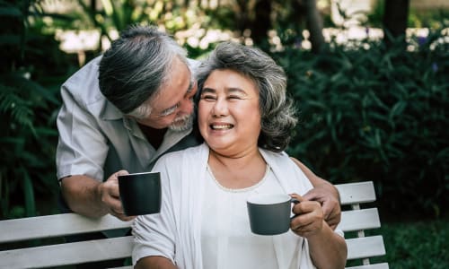 A resident couple on a bench near Merrill Gardens. 