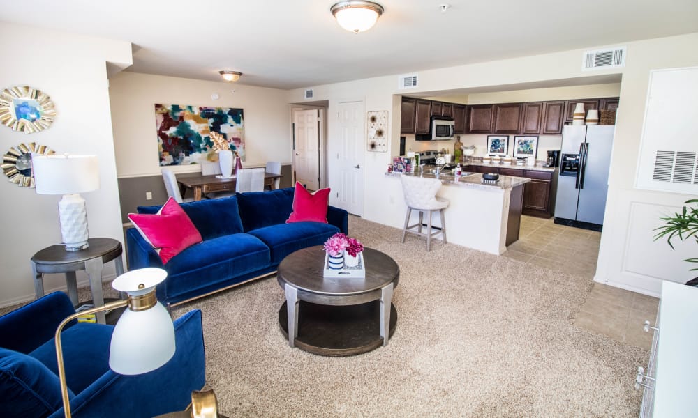 Spacious living room with plush carpet at Tuscany Place in Lubbock, Texas.