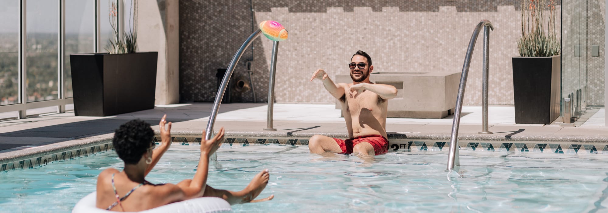 Residents hanging out at the rooftop pool at Kenect in Chicago, Illinois