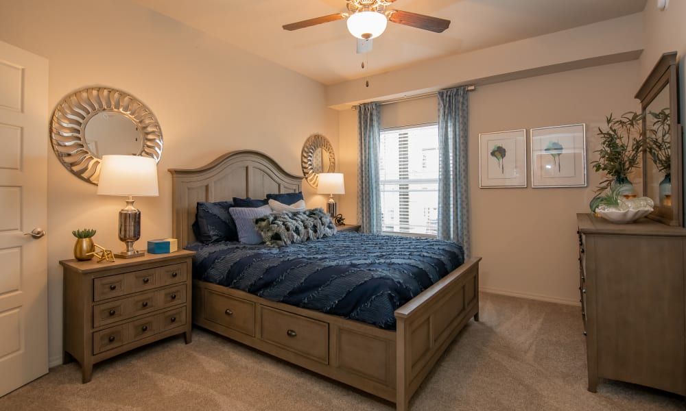 Cozy bedroom at Bend at New Road Apartments in Waco, Texas