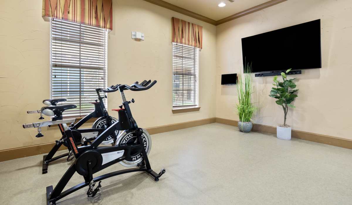 Fitness center with cardio machines at Park Avenue at Boulder Creek in Houston, Texas