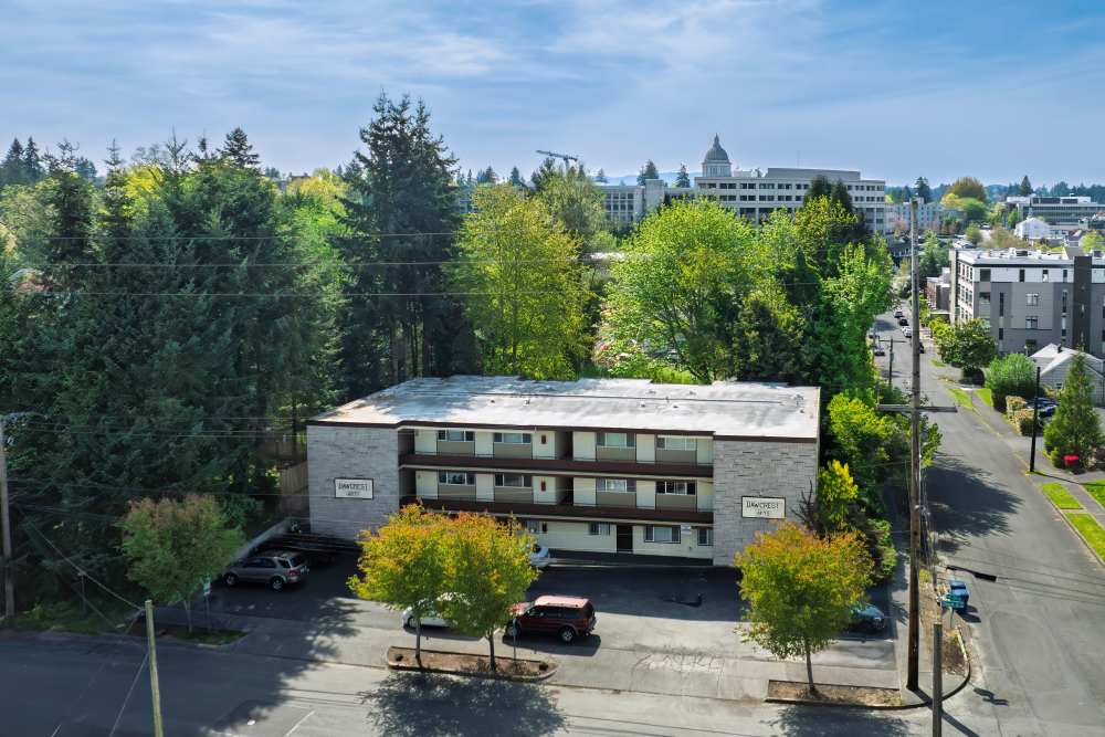 Aerial view of the community with trees all around at Dawcrest Apartments in Olympia, Washington