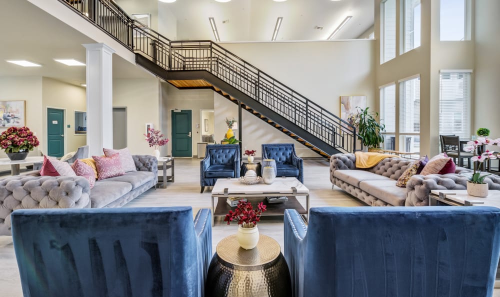 Downstairs lounge with staircase at HOLI Senior Living