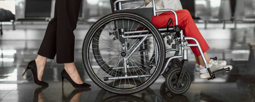 Resident being pushed in a wheel chair at Corp Site Testing in Bend, Oregon