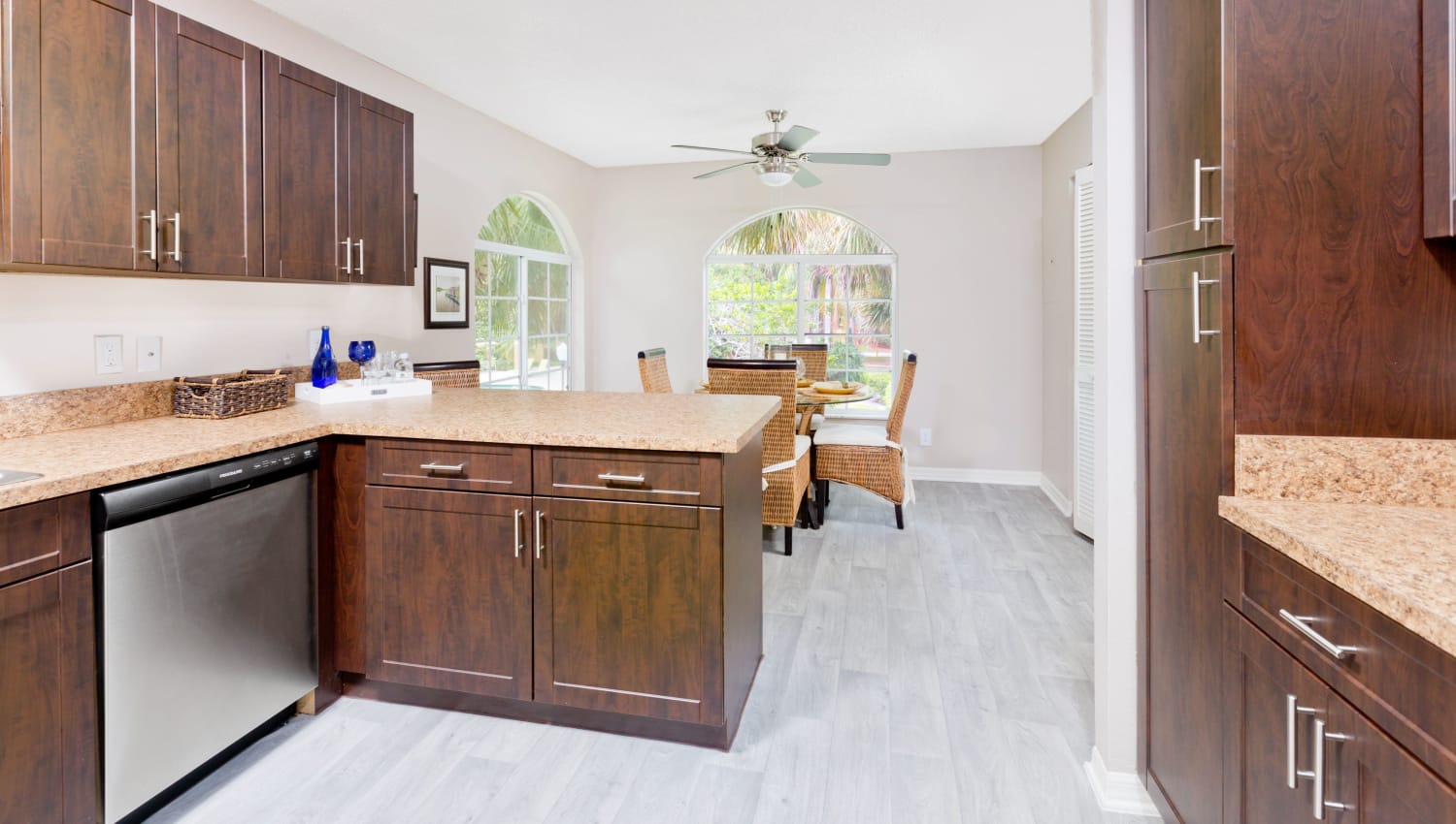 Model kitchen and dining room at Indian Hills Apartments in Boynton Beach, Florida