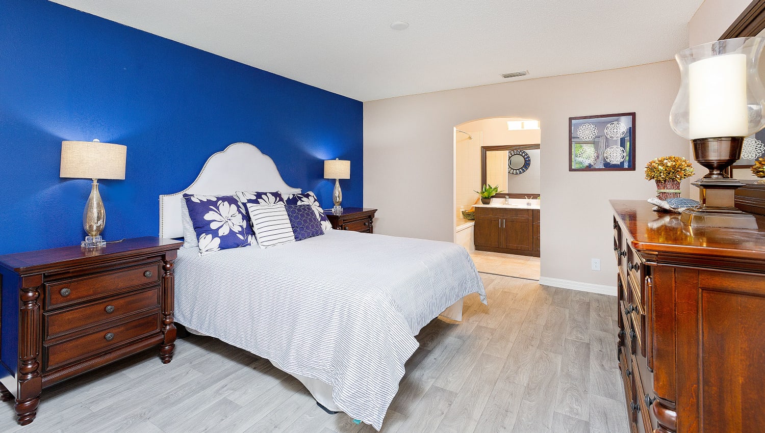 Primary bedroom with attached bathroom at Indian Hills Apartments in Boynton Beach, Florida
