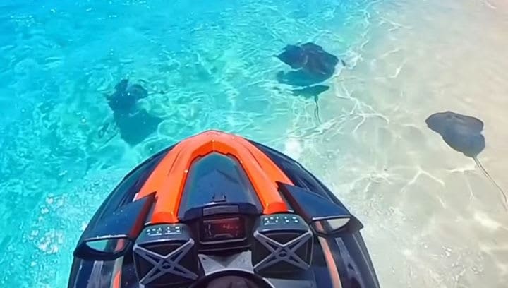 Jet ski with rays underwater