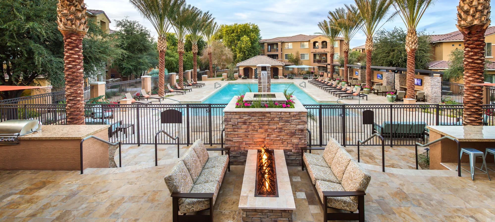 View of the swimming pool from one of the fire pits at Stone Oaks in Chandler, Arizona