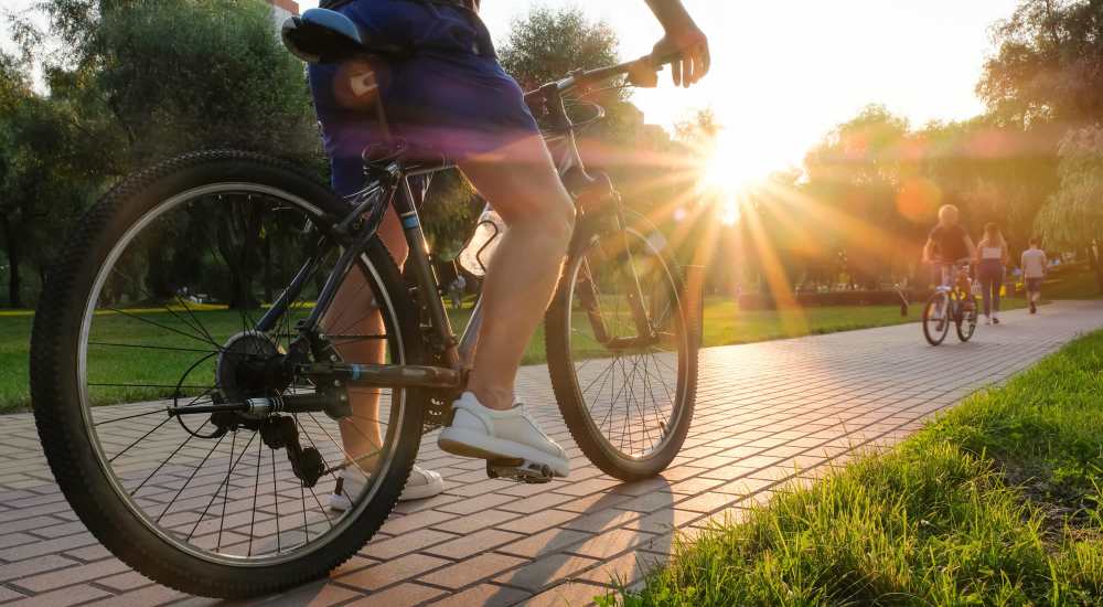 Resident biking near Atrium Flats in Nashville, Tennessee