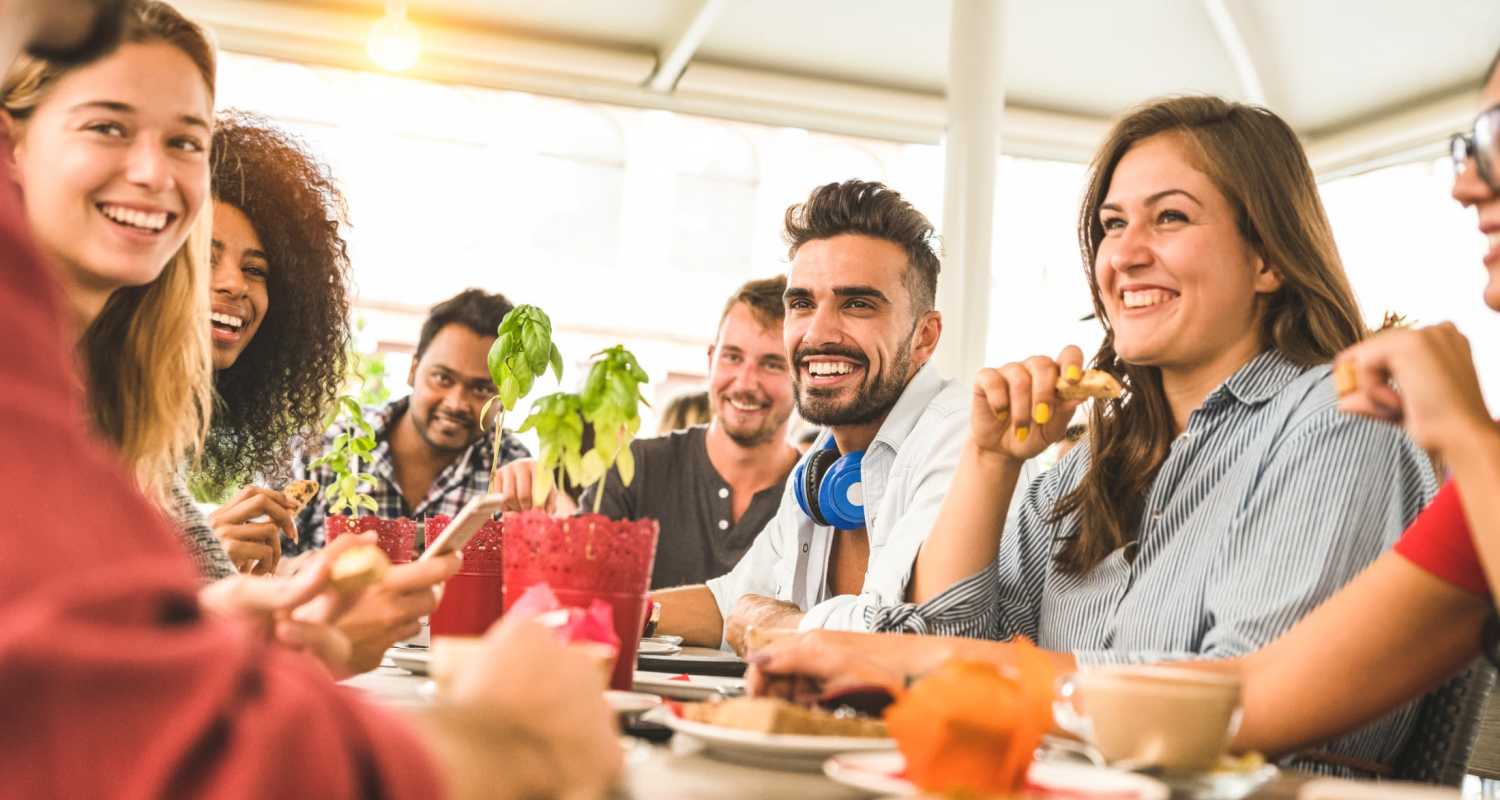 A group of friends enjoying lunch together at a cafe near Oxford Oaks Apartments in Edmond, Oklahoma
