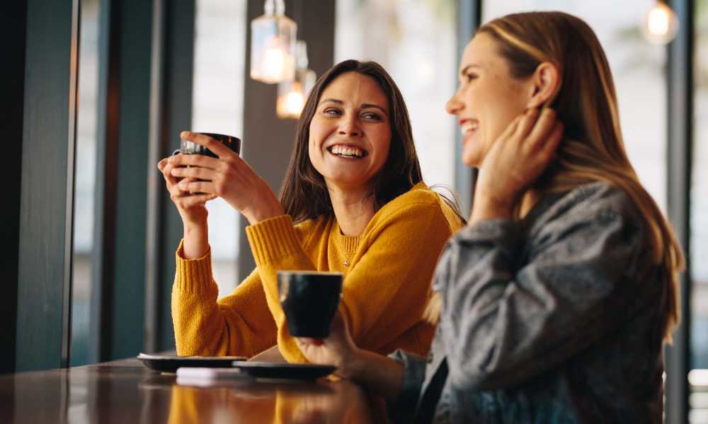 Resident friends having coffee near The Manor Townhomes in Winston-Salem, North Carolina