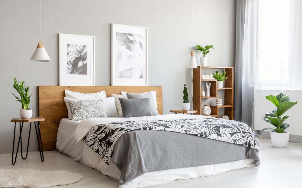 Modern bedroom with a gray bedding  at Stonebridge Crossing Apartment Homes in Cordova, Tennessee