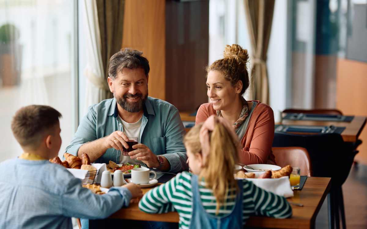 Resident family having food in local restaurant near Meridian Oaks in Tallahassee, Florida