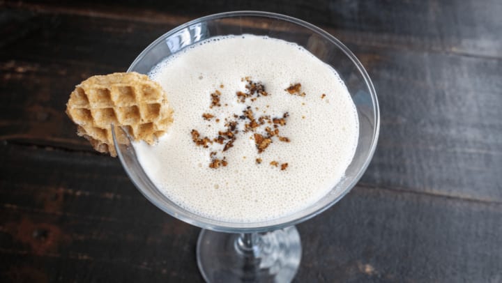 Maple cocktail with small waffle on rim