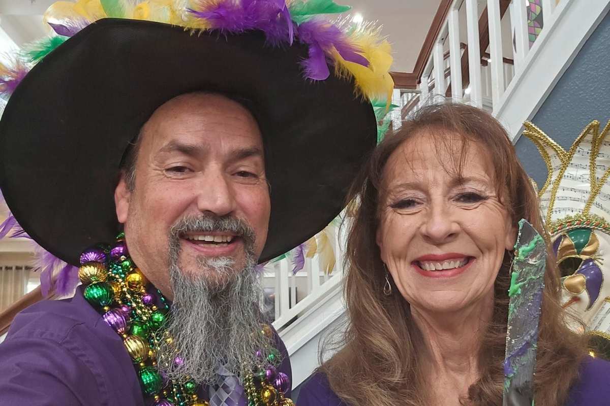Couple taking a picture together during Mardi gras Town Village in Oklahoma City, Oklahoma
