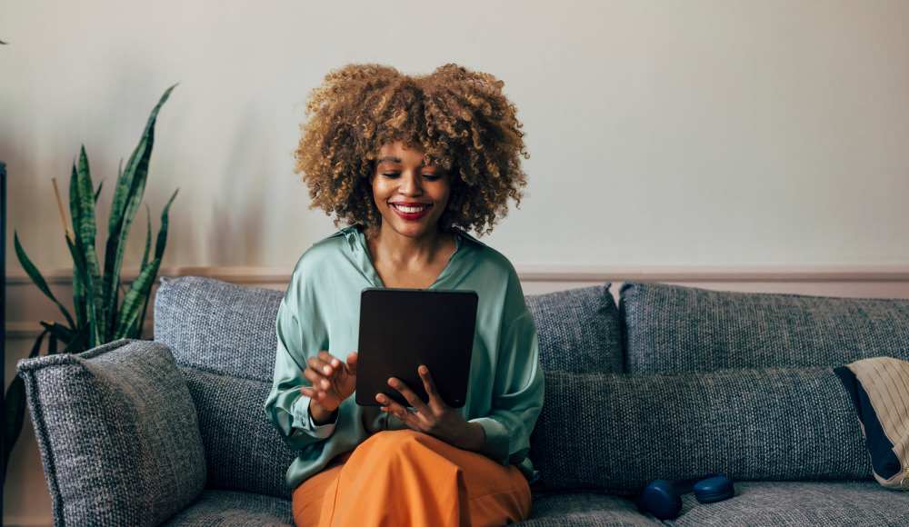 Resident using her tab at Iwood I in Inglewood, California