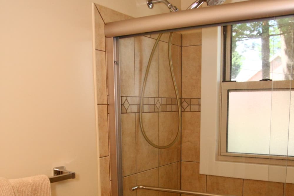 Bathroom shower and towel rack at Riverwood Commons