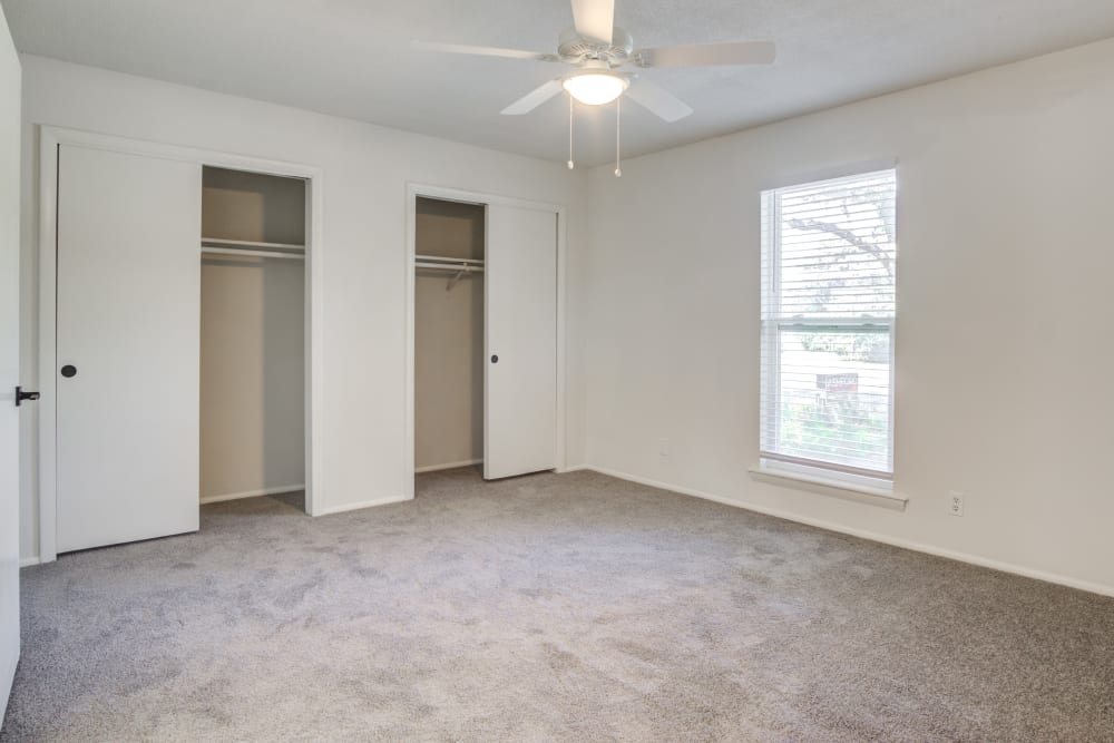 Bedroom with ample closet space in apartment at Palmetto Square in Charleston, South Carolina