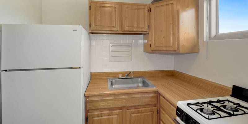 Model kitchen with gas stove at Barclay Square Apartments in Baltimore, Maryland