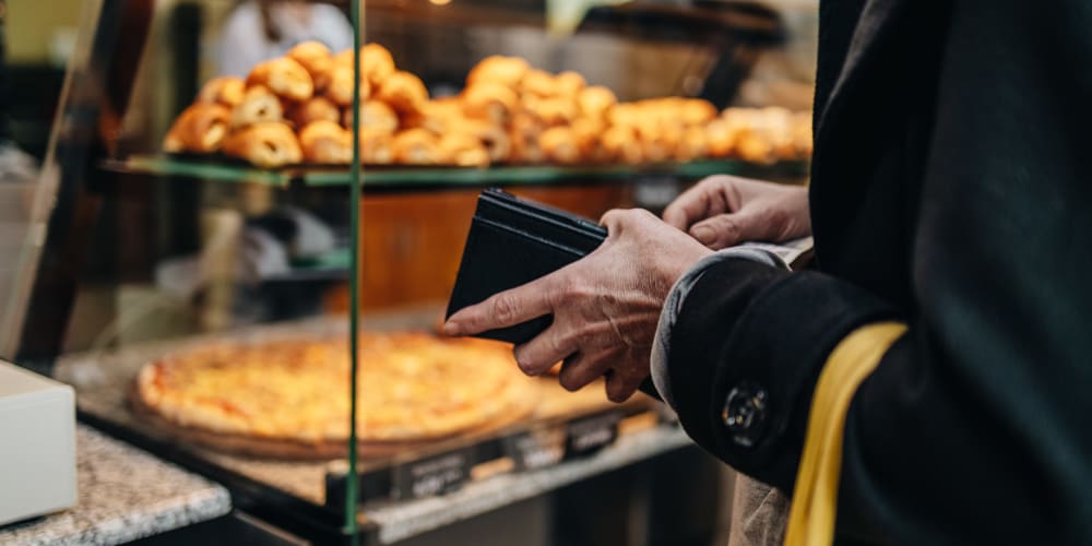 A resident paying for their food in a restaurant near River Forest in Chester, Virginia