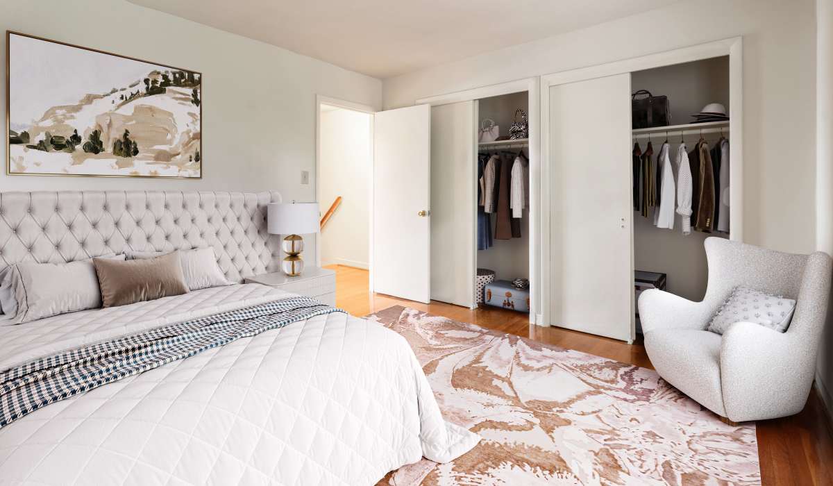 Spacious bedroom with white beddings at Landmark at Gayton Apartments in Richmond, Virginia
