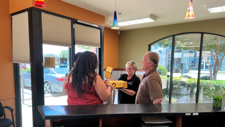 Manager duo at Chino Hills Self Storage, Sandy and Randy, receiving appreciation gifts from our loyal customers