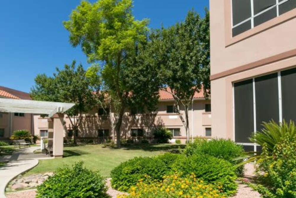 Elegant lounge area with seating and lamp at The Citadel Senior Living in Mesa, Arizona