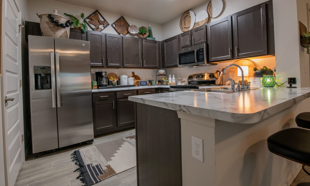 Bright and fully equipped kitchen at Redbud Ranch Apartments in Broken Arrow, Oklahoma