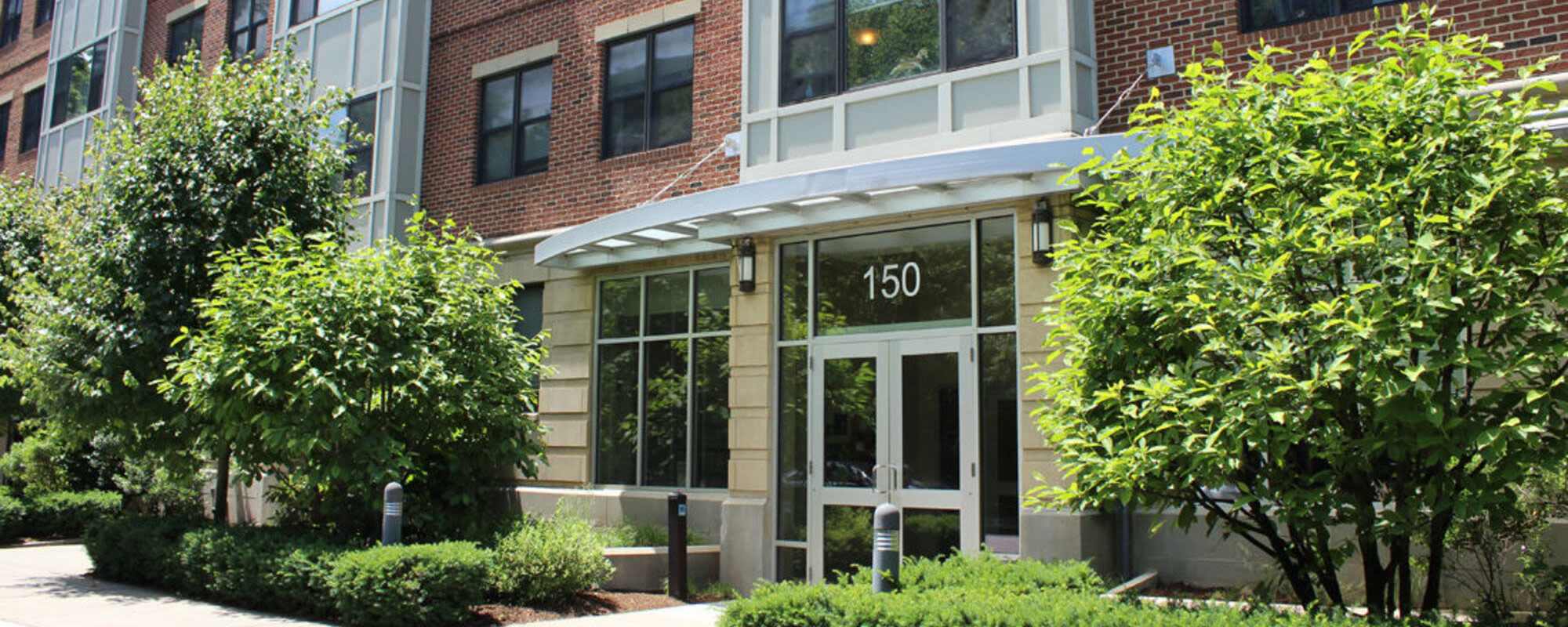 Apartment building entrance at The St. Aidan in Brookline, Massachusetts