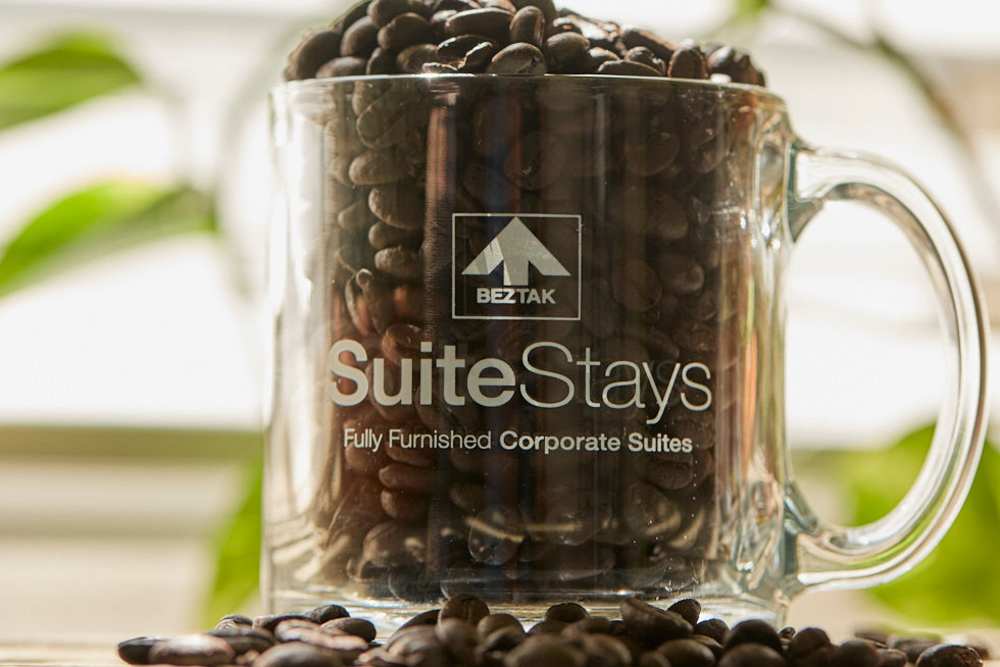 SuiteStays logo on a mug at Innova in Novi, Michigan