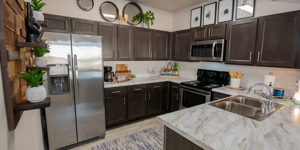 Beautiful new kitchen with breakfast bar at Artisan Crossing in Norman, Oklahoma