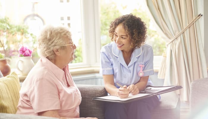 A resident and caretaker discussing options at The Groves at Oak Ridge in Oak Ridge, Tennessee