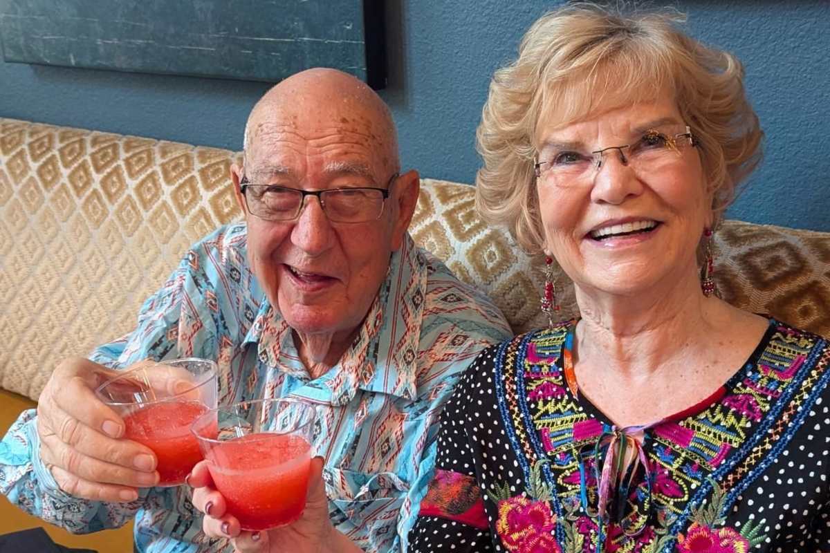 Two residents sharing a drink together at Watercrest at Shadow Creek Ranch in Pearland, Texas