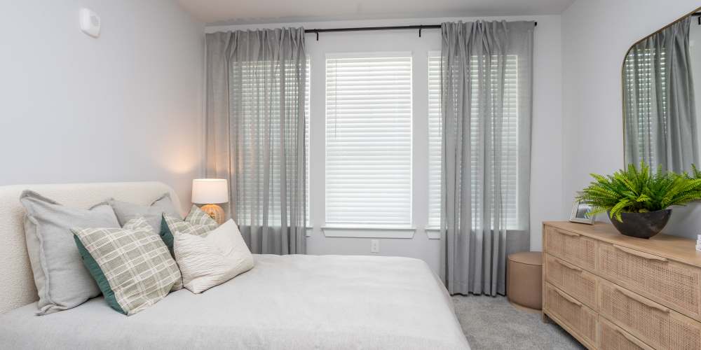 Bedroom with large comfortable bed and windows at Proximity New Bern in New Bern, North Carolina