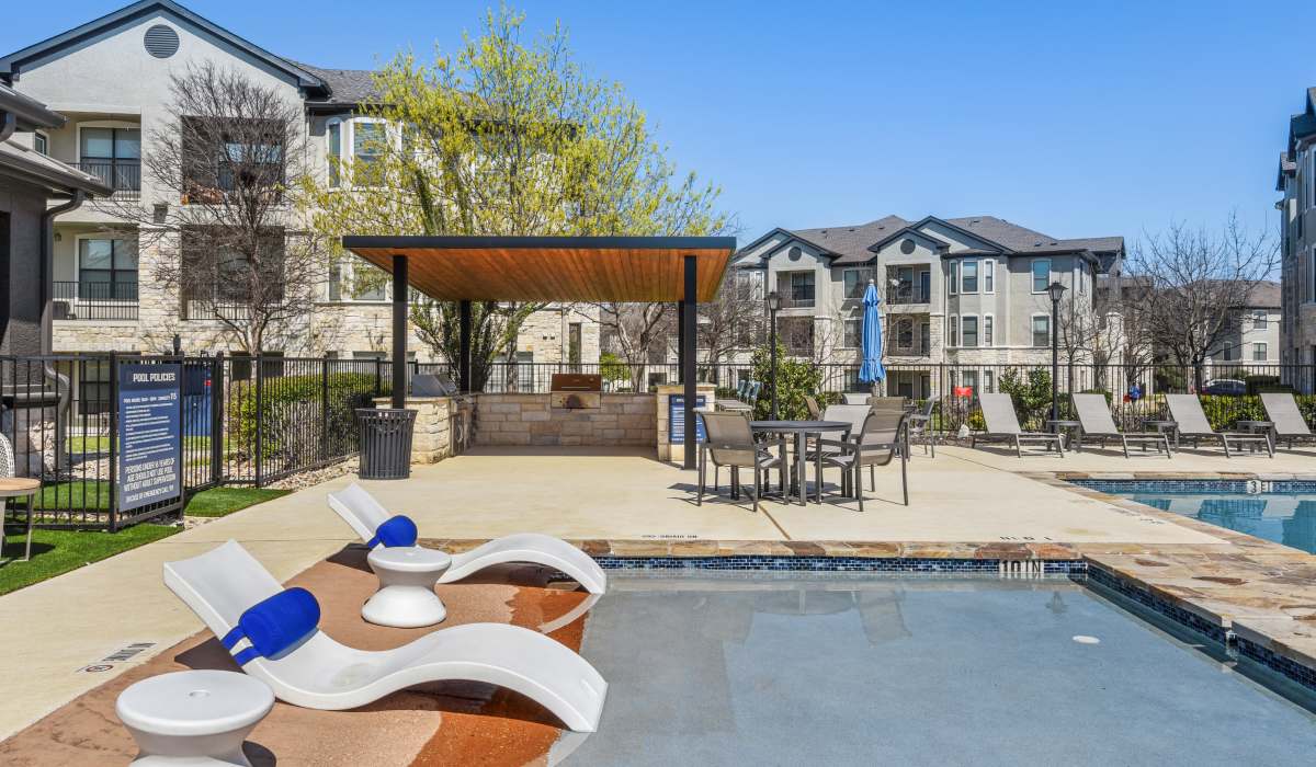 Pool area with lounge chair at  Collier in Pflugerville, Texas   