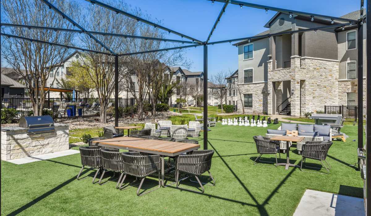 Courtyard seating area with grilling station at Collier in Pflugerville, Texas