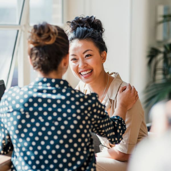 Two female friends having a conversation at Key Storage in San Antonio, Texas,