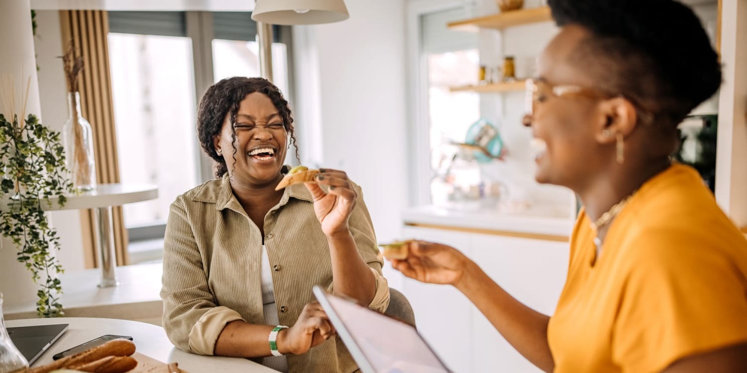 Laughing residents in their home at Sola Westchase in Houston, Texas