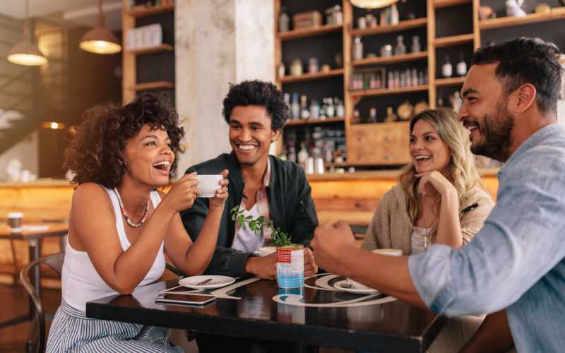 Friends having coffee near Autumn Chase Apartments in Vancouver, Washington