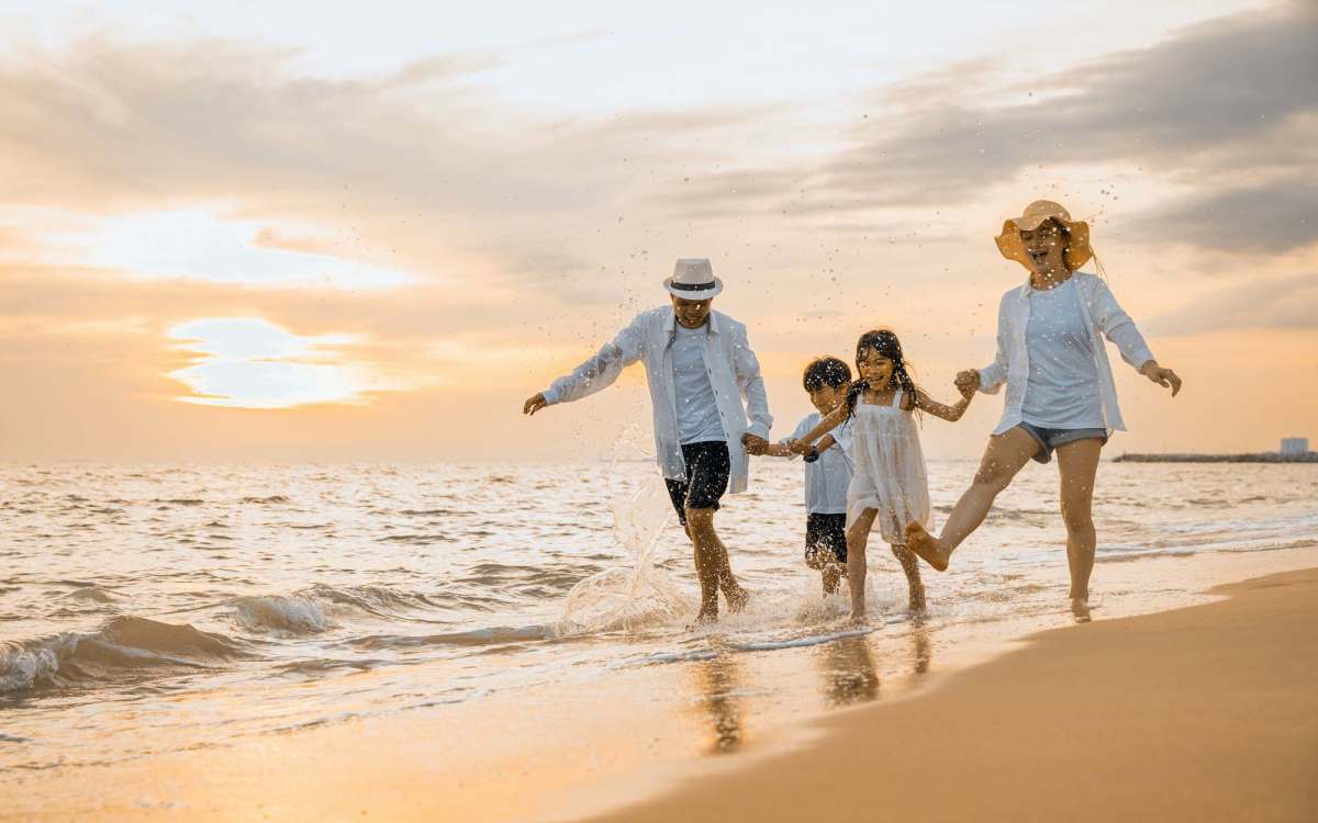 Resident family enjoying in the beach near El Cid Apartments in West Palm Beach, Florida