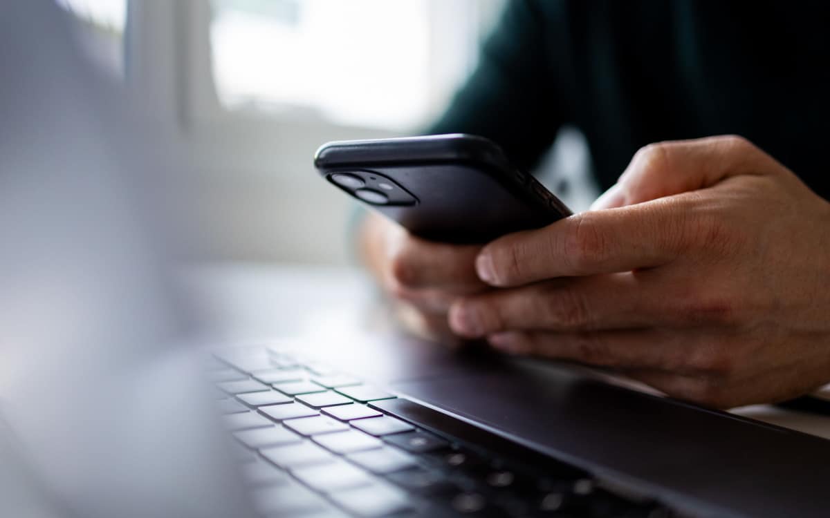Modern resident using online resident portal at Malvern Lakes Apartments in Fredericksburg, Virginia