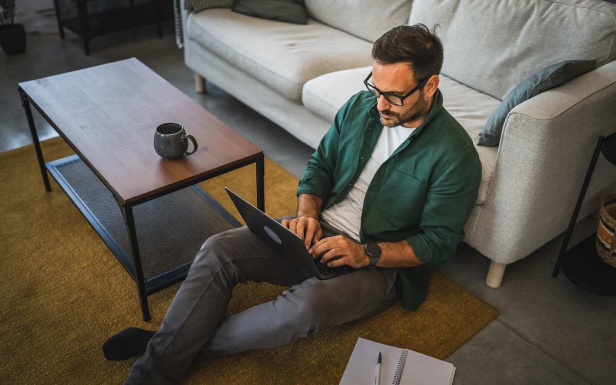 Resident working on his laptop at Maplewood Court in Bridgeport, Connecticut