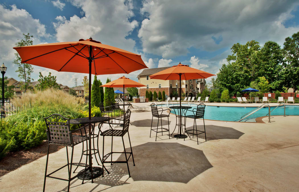 Shaded seating near the pool at Richland Falls in Murfreesboro, Tennessee