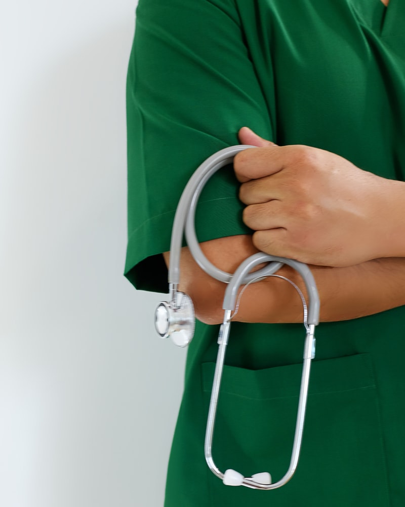 Doctor in green uniform at Lofts At Navicent in Macon, Georgia